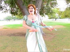 Busty redhead hussy fucks her twat with a dildo in a park