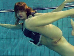 Foxy Russian bimbo strips out of her clothes in the pool