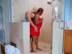 Bald boy relaxes in the bathroom together with curvy black diva