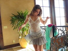 Alluring brunette chick masturbates her snatch on the stairs