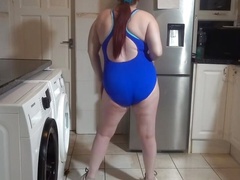 wife dancing sexy blue in swimsuit and sneakers
