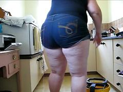 My chubby GF wearing shorts washes the floor and shows her big ass